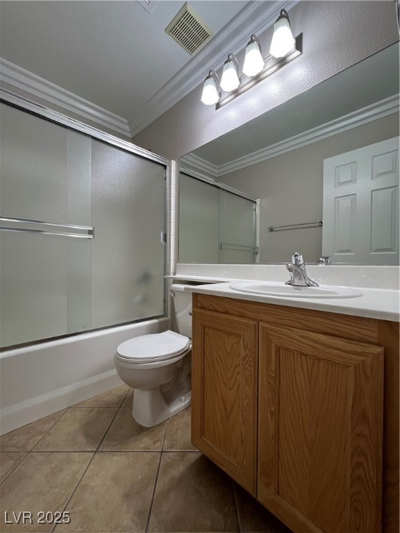 7195 Cestrum Road Las Vegas, NV 89113 - Photo 12 of 33 Bathroom featuring ornamental molding, toilet, til