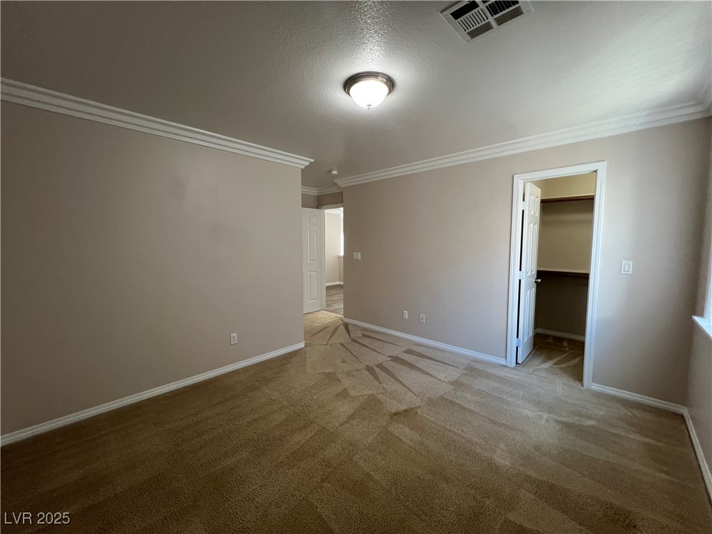 7195 Cestrum Road Las Vegas, NV 89113 - Photo 14 of 33 Unfurnished bedroom with crown molding, baseboards