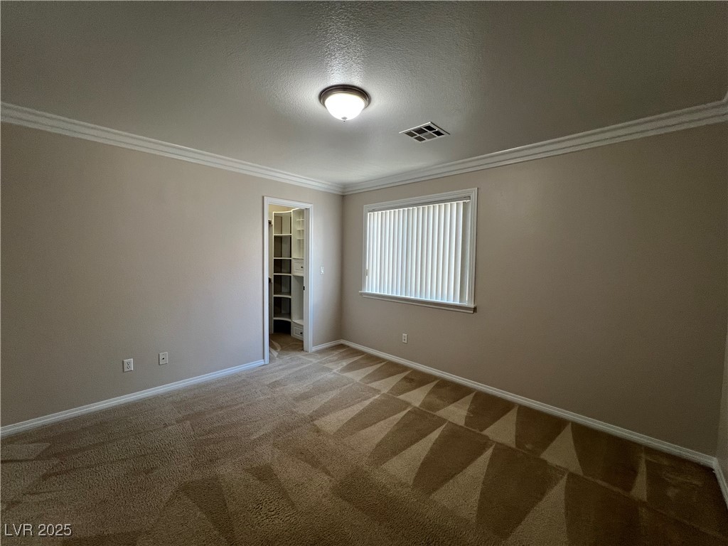 7195 Cestrum Road Las Vegas, NV 89113 - Photo 15 of 33 Unfurnished room featuring carpet floors, ornament