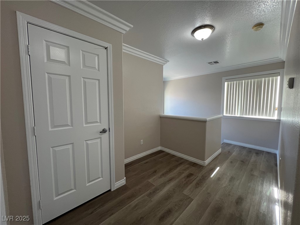 7195 Cestrum Road Las Vegas, NV 89113 - Photo 18 of 33 Spare room with crown molding, a smoke detector, d