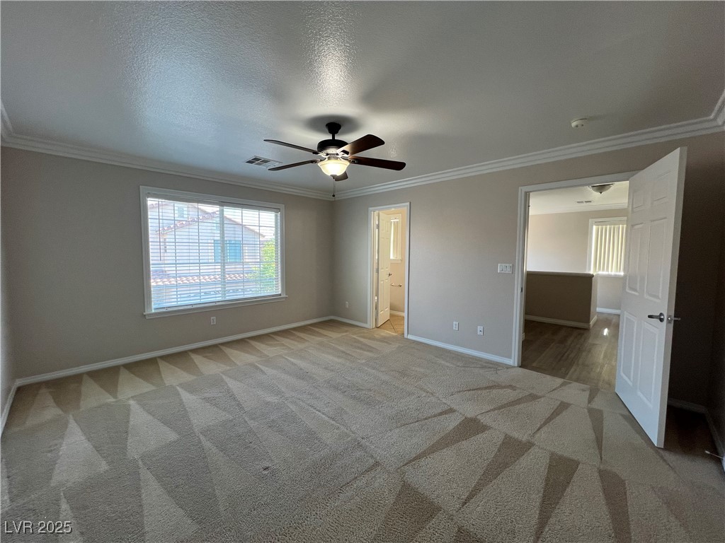 7195 Cestrum Road Las Vegas, NV 89113 - Photo 21 of 33 Unfurnished bedroom featuring baseboards, light ca