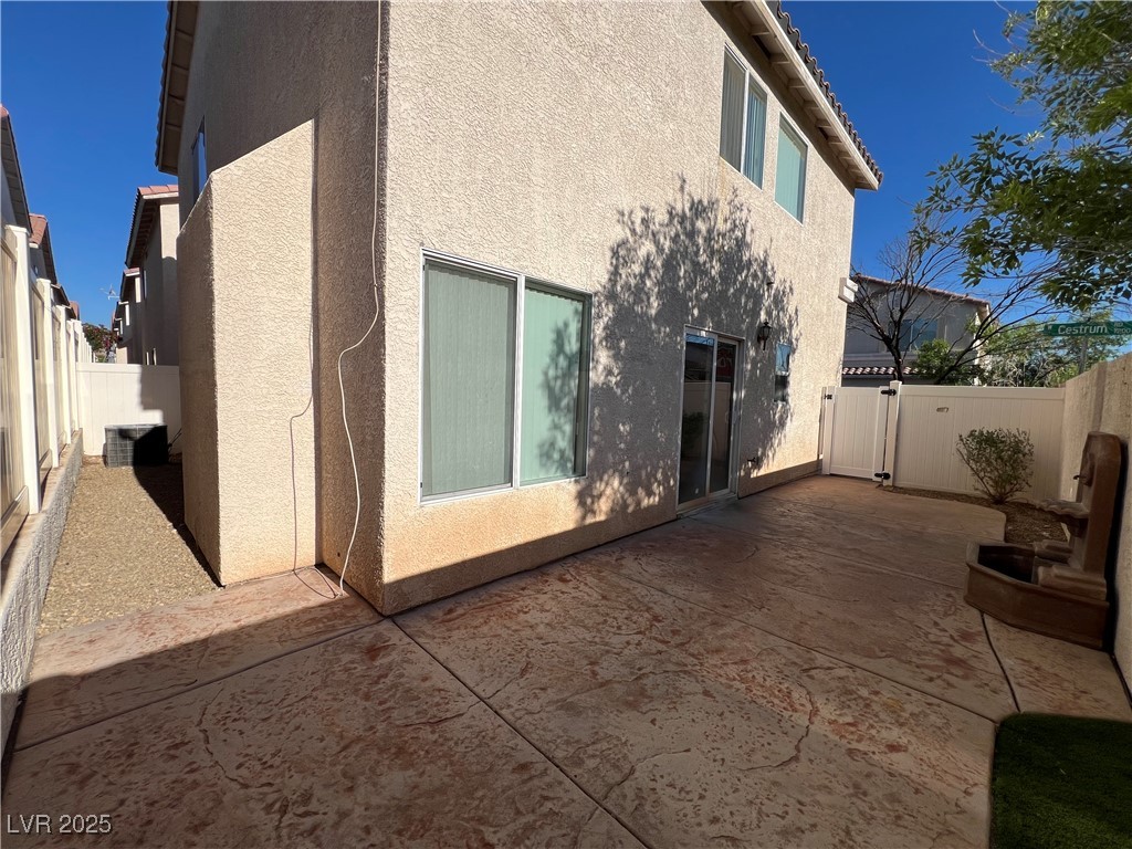 7195 Cestrum Road Las Vegas, NV 89113 - Photo 26 of 33 View of home's exterior with stucco siding, a pati