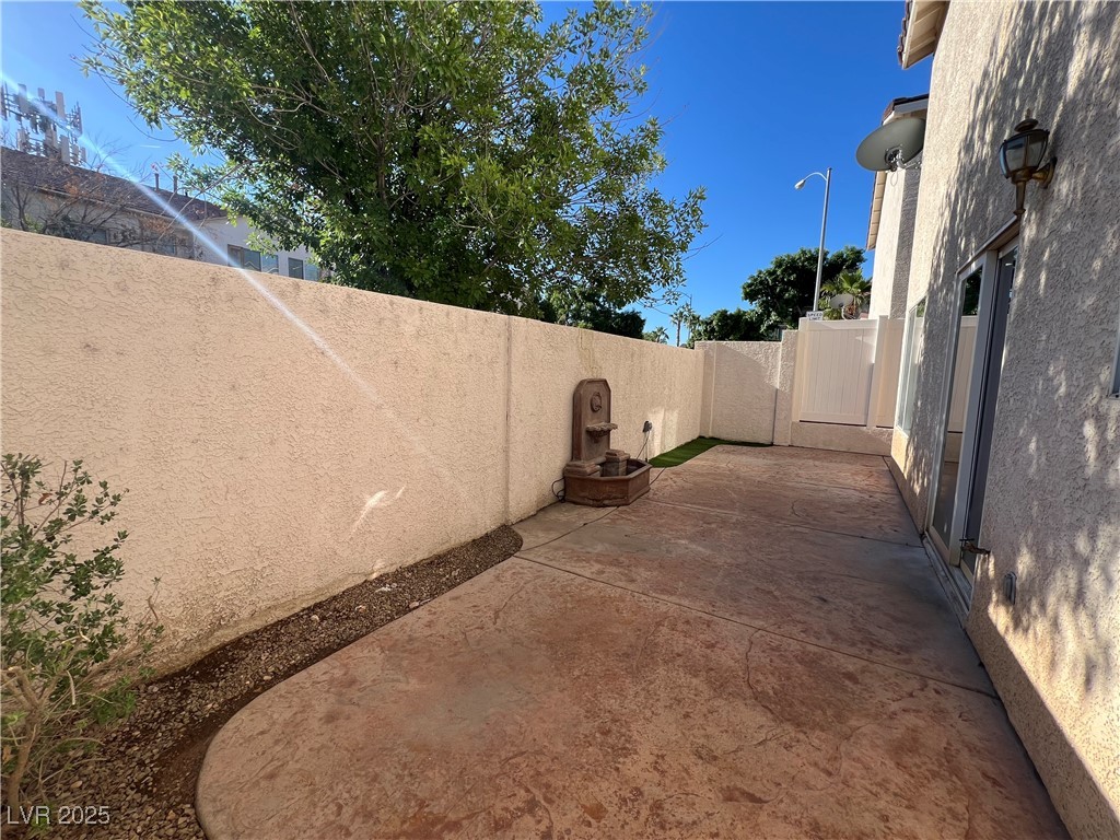 7195 Cestrum Road Las Vegas, NV 89113 - Photo 28 of 33 View of patio featuring a fenced backyard