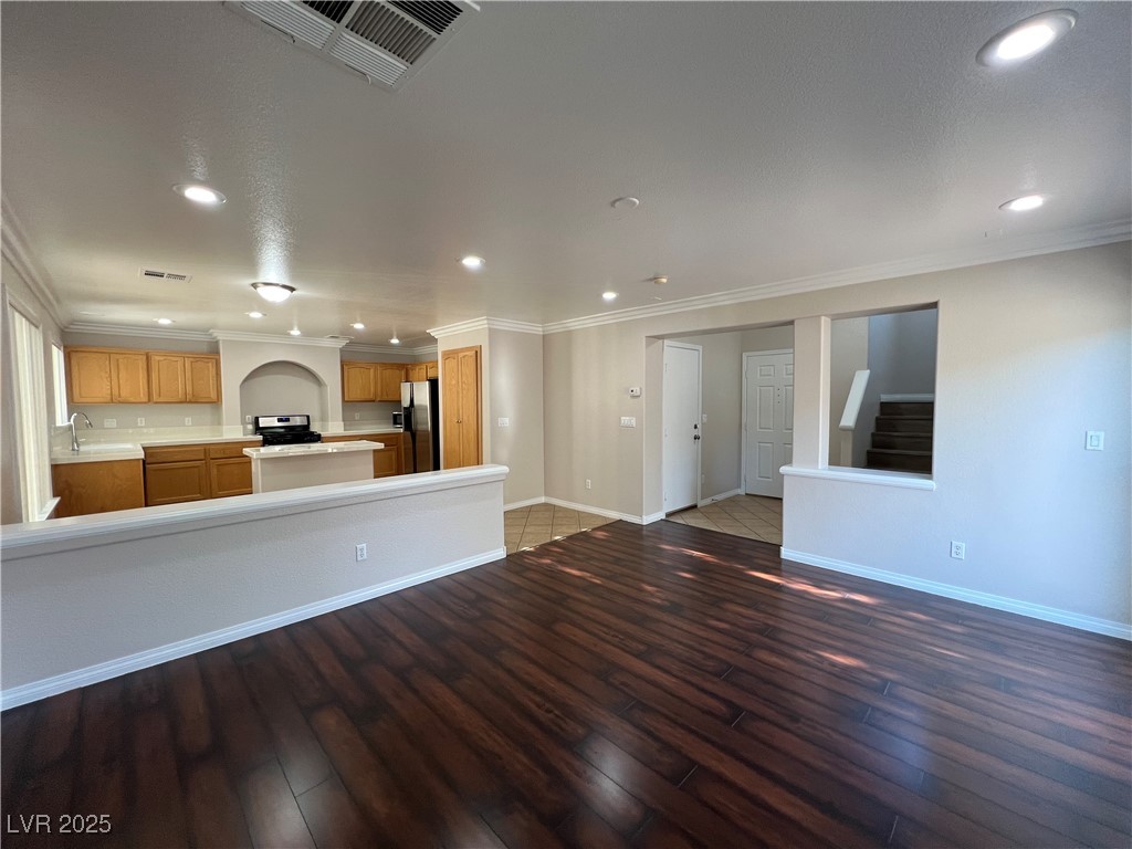 7195 Cestrum Road Las Vegas, NV 89113 - Photo 5 of 33 Unfurnished living room featuring wood-type floori