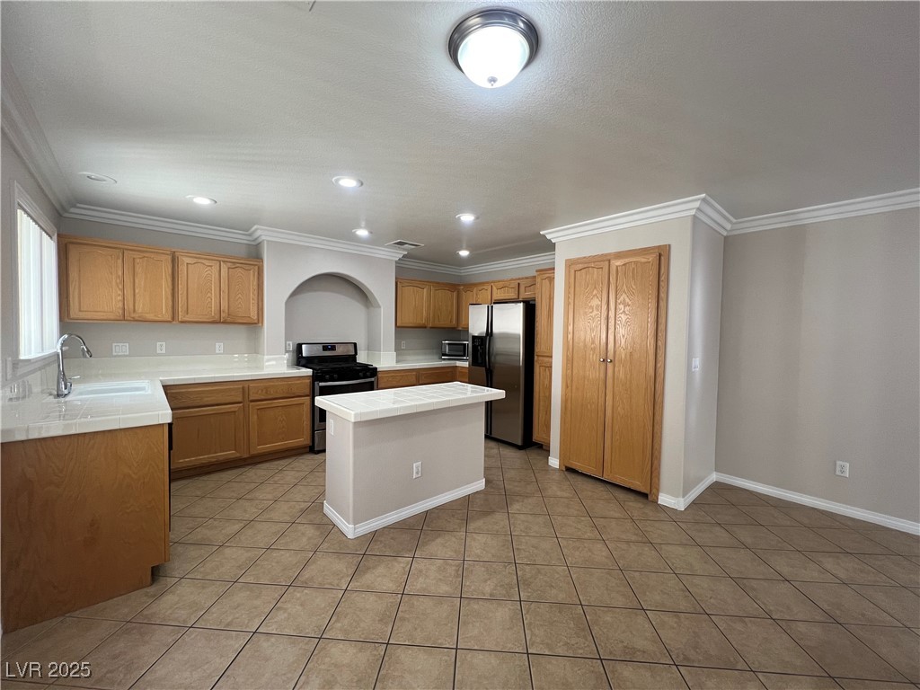 7195 Cestrum Road Las Vegas, NV 89113 - Photo 6 of 33 Kitchen with appliances with stainless steel finis