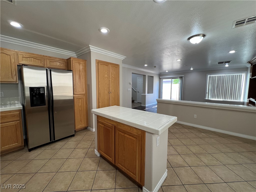 7195 Cestrum Road Las Vegas, NV 89113 - Photo 7 of 33 Kitchen featuring stainless steel fridge with ice