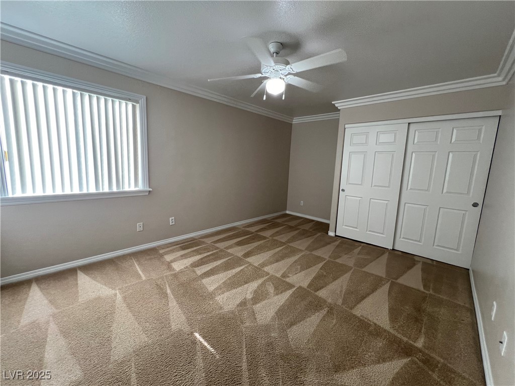 7195 Cestrum Road Las Vegas, NV 89113 - Photo 9 of 33 Unfurnished bedroom featuring carpet, a closet, ba