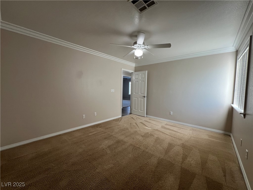 7195 Cestrum Road Las Vegas, NV 89113 - Photo 10 of 33 Empty room featuring ornamental molding, a ceiling