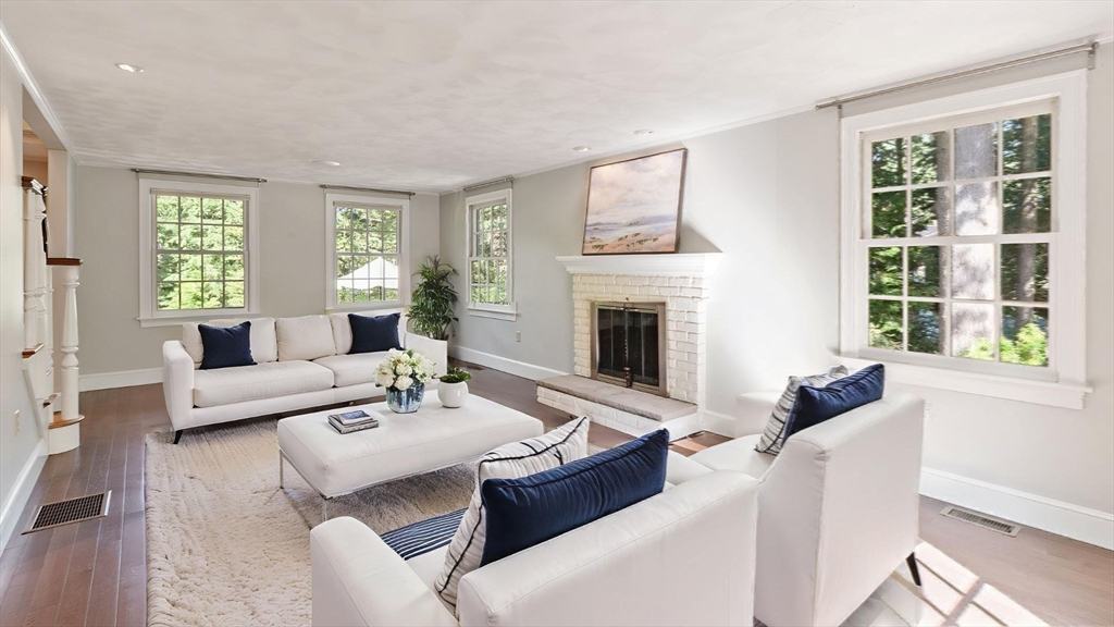 1 Seneca Circle Andover, MA 01810 - Photo 20 of 40 a living room with furniture and a fireplace