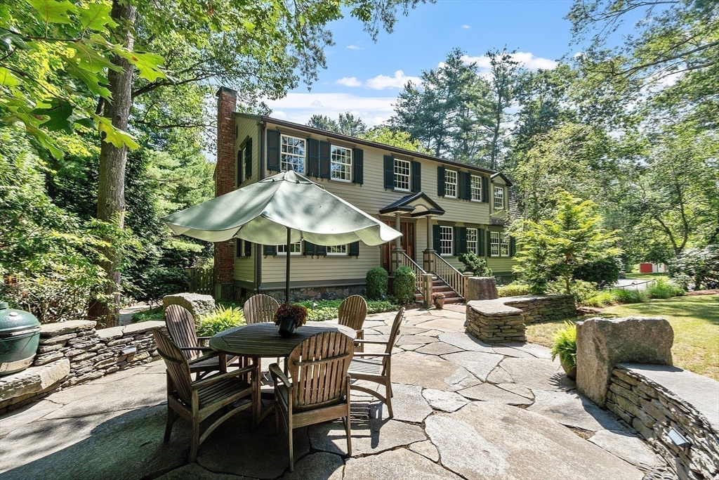1 Seneca Circle Andover, MA 01810 - Photo 2 of 40 a view of a patio with table and chairs and potted plants