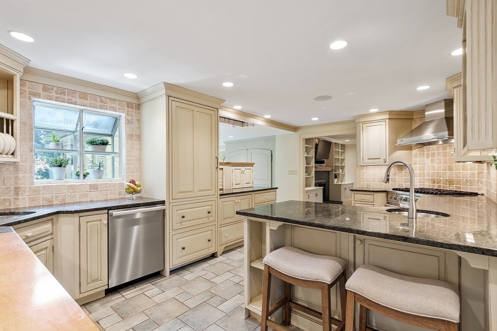 1 Seneca Circle Andover, MA 01810 - Photo 9 of 40 a kitchen with counter top space cabinets and sink