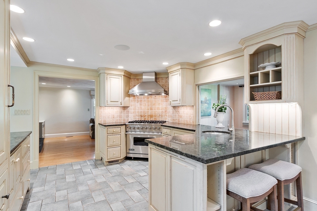 1 Seneca Circle Andover, MA 01810 - Photo 10 of 40 a kitchen with stainless steel appliances granite countertop stove top oven and cabinets