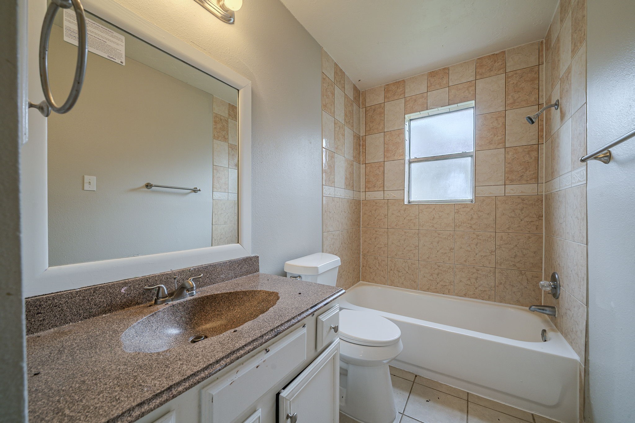4011 Monteith Drive Spring, TX 77373 - Photo 21 of 28 a bathroom with a granite countertop sink toilet and shower