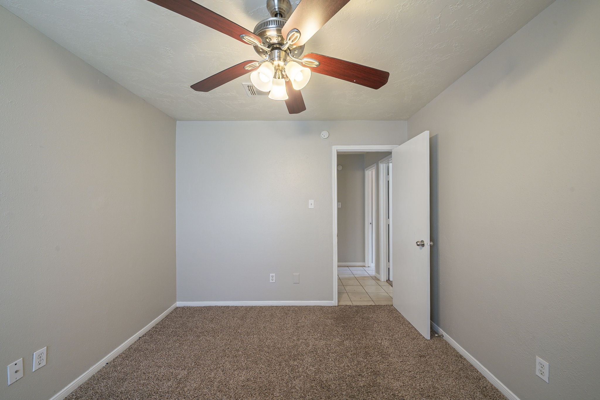 4011 Monteith Drive Spring, TX 77373 - Photo 25 of 28 an empty room with windows and fan