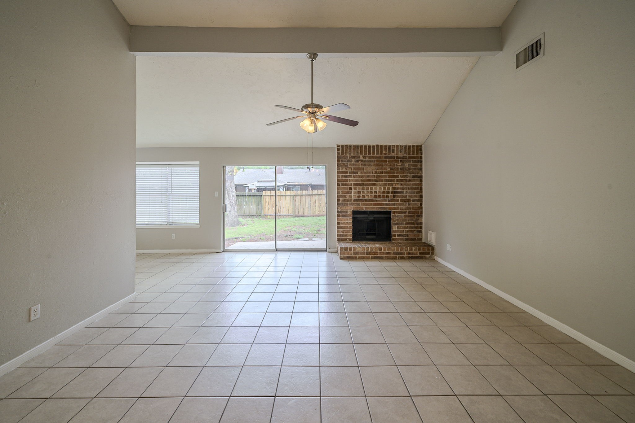 4011 Monteith Drive Spring, TX 77373 - Photo 8 of 28 an empty room with windows and fireplace