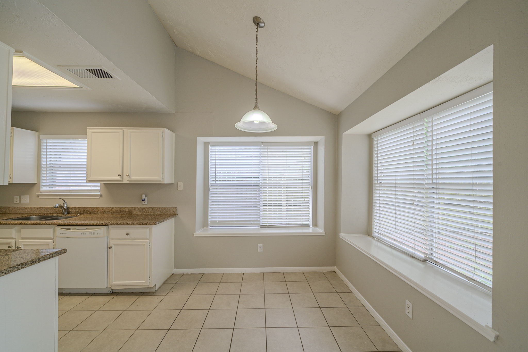 4011 Monteith Drive Spring, TX 77373 - Photo 10 of 28 a view of a kitchen with a sink cabinets and window