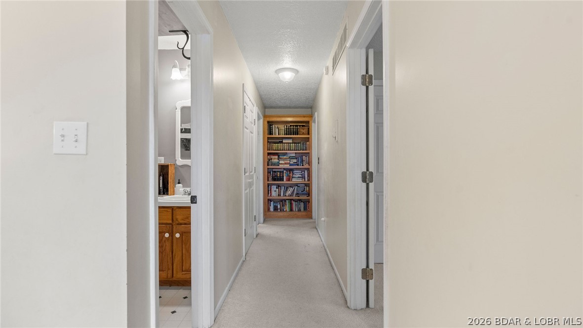 46 County Rd MM-10 Eugene, MO 65032 - Photo 24 of 92 Upstairs Hallway