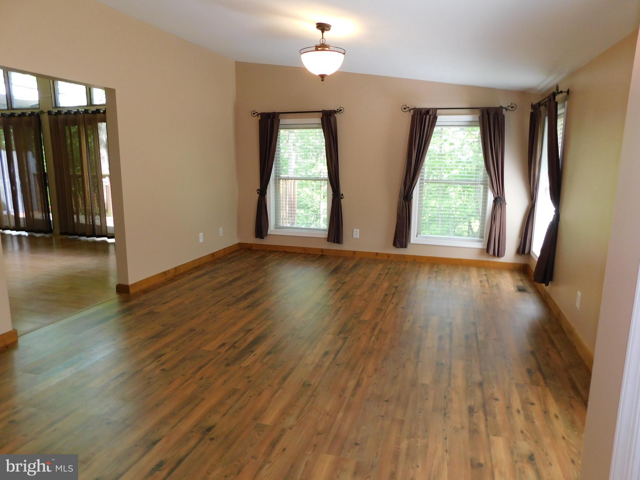 301 Animikean Ridge Hedgesville, WV 25427 - Photo 12 of 51 Wood laminate floors in Den/Dining Room