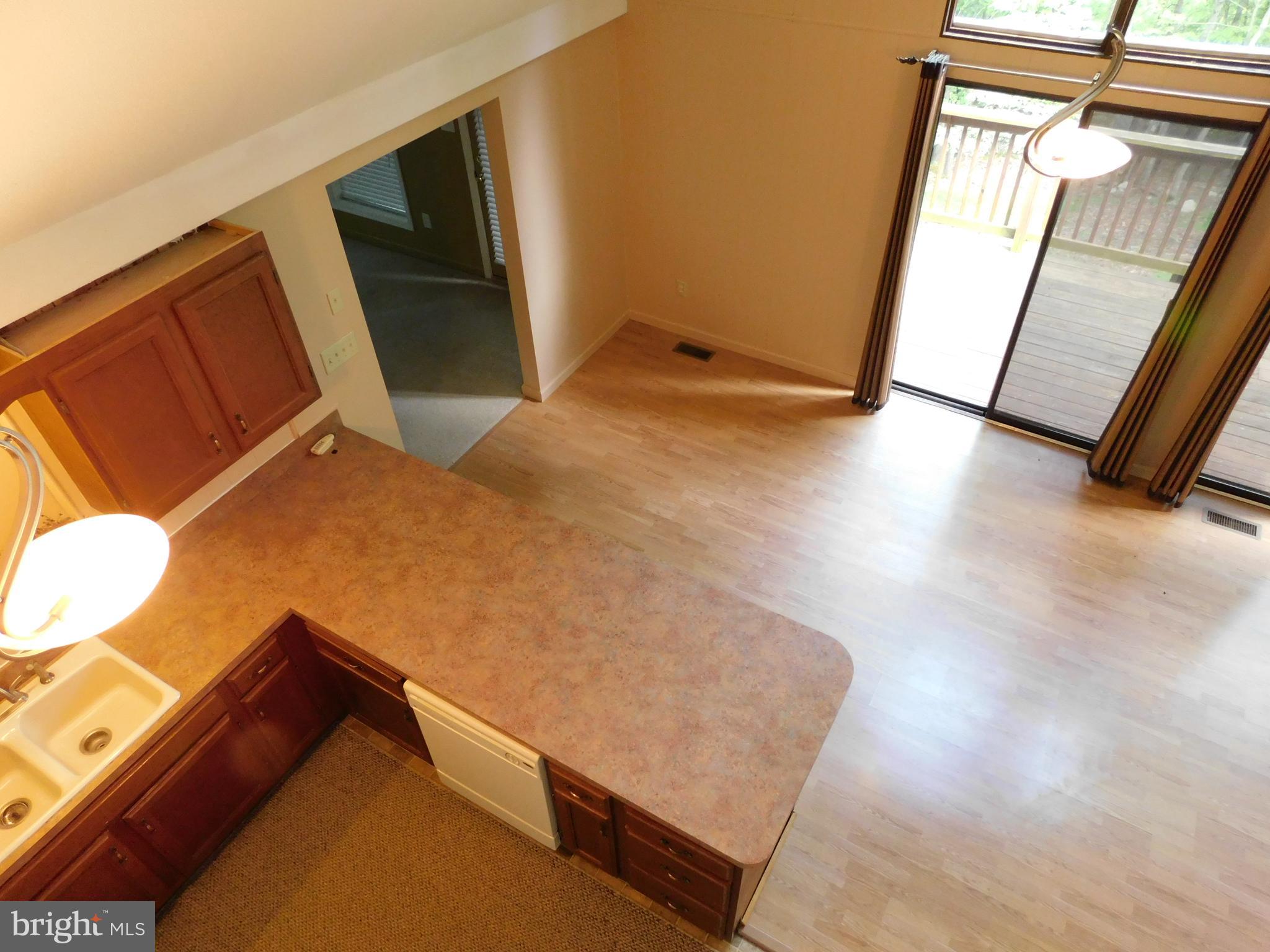 301 Animikean Ridge Hedgesville, WV 25427 - Photo 38 of 51 View of kitchen and dining area from loft