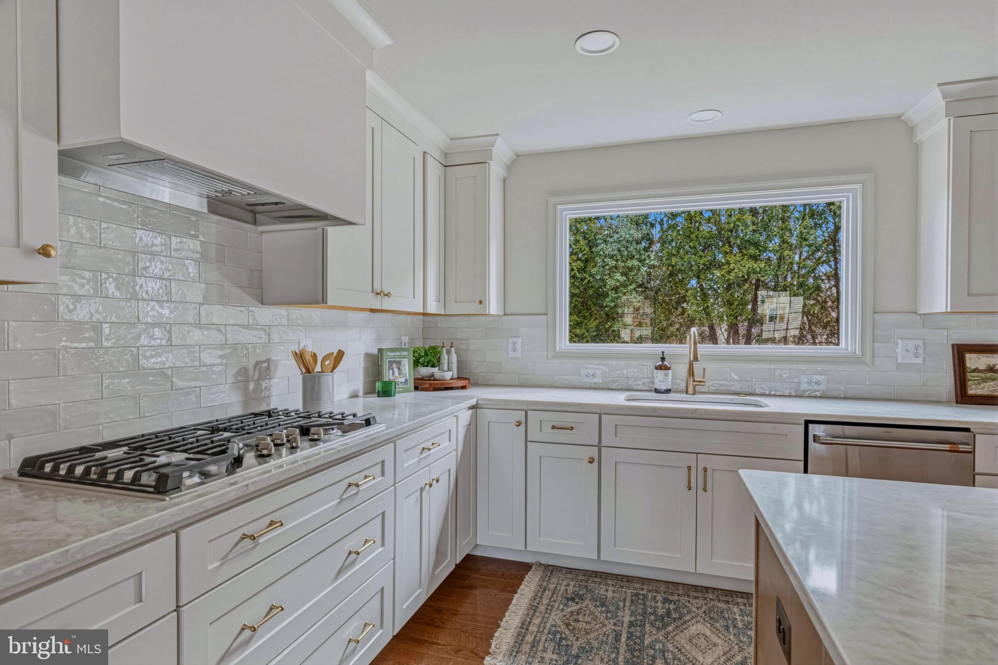 1331 Deep Run Lane Reston, VA 20190 - Photo 12 of 51 a kitchen with a sink stove and cabinets