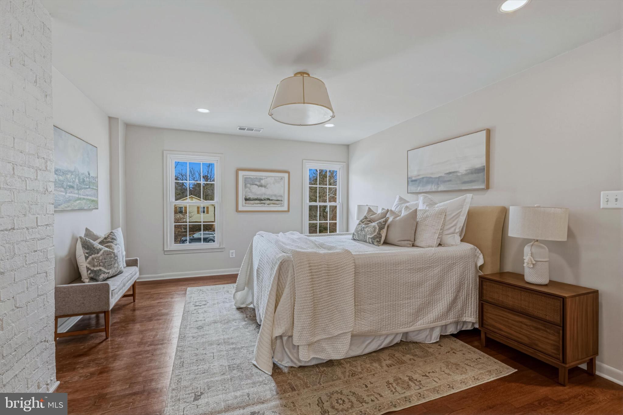 1331 Deep Run Lane Reston, VA 20190 - Photo 23 of 51 a spacious bedroom with a bed and wooden floor
