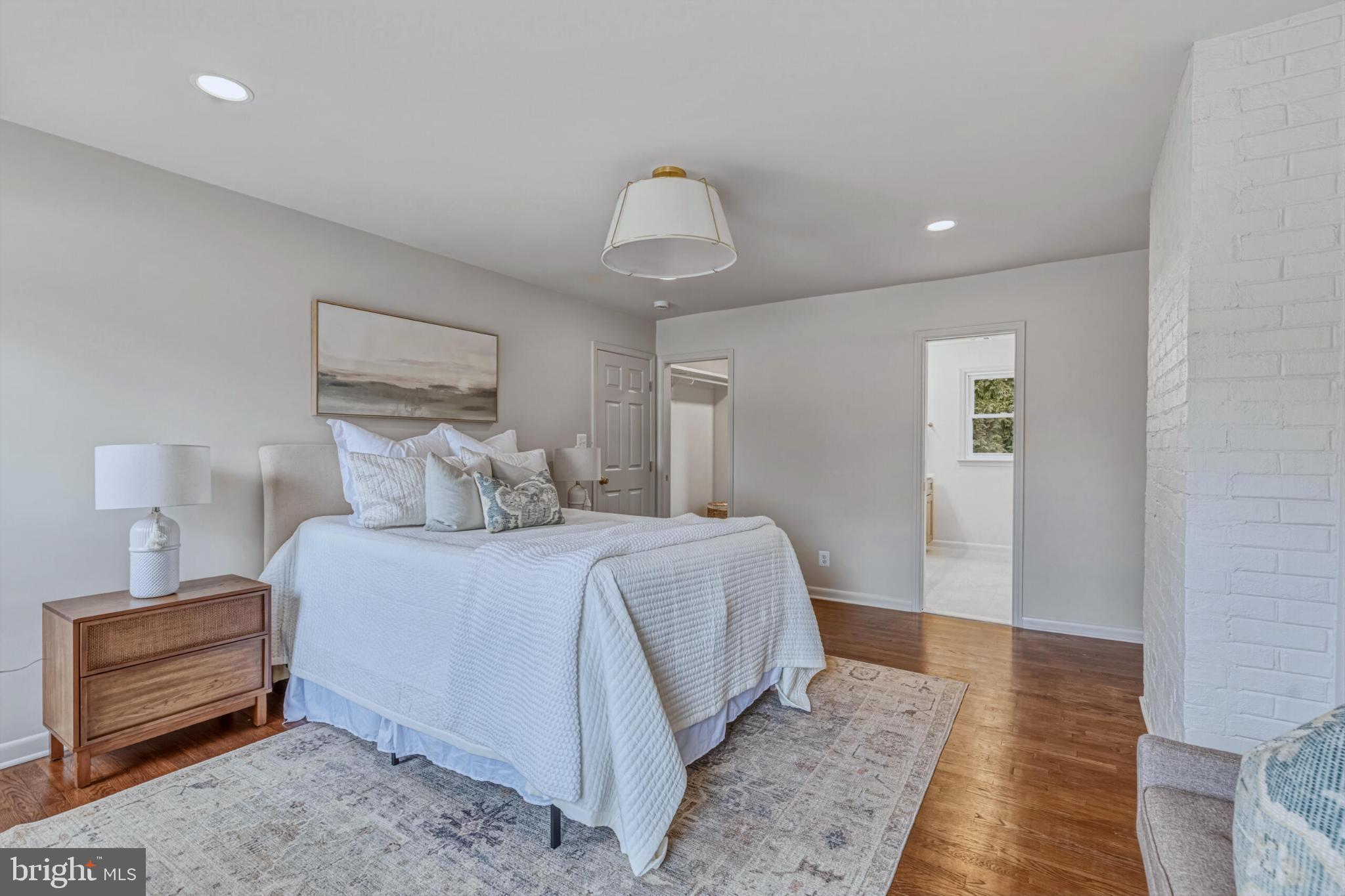 1331 Deep Run Lane Reston, VA 20190 - Photo 24 of 51 a bedroom with a bed and wooden floor