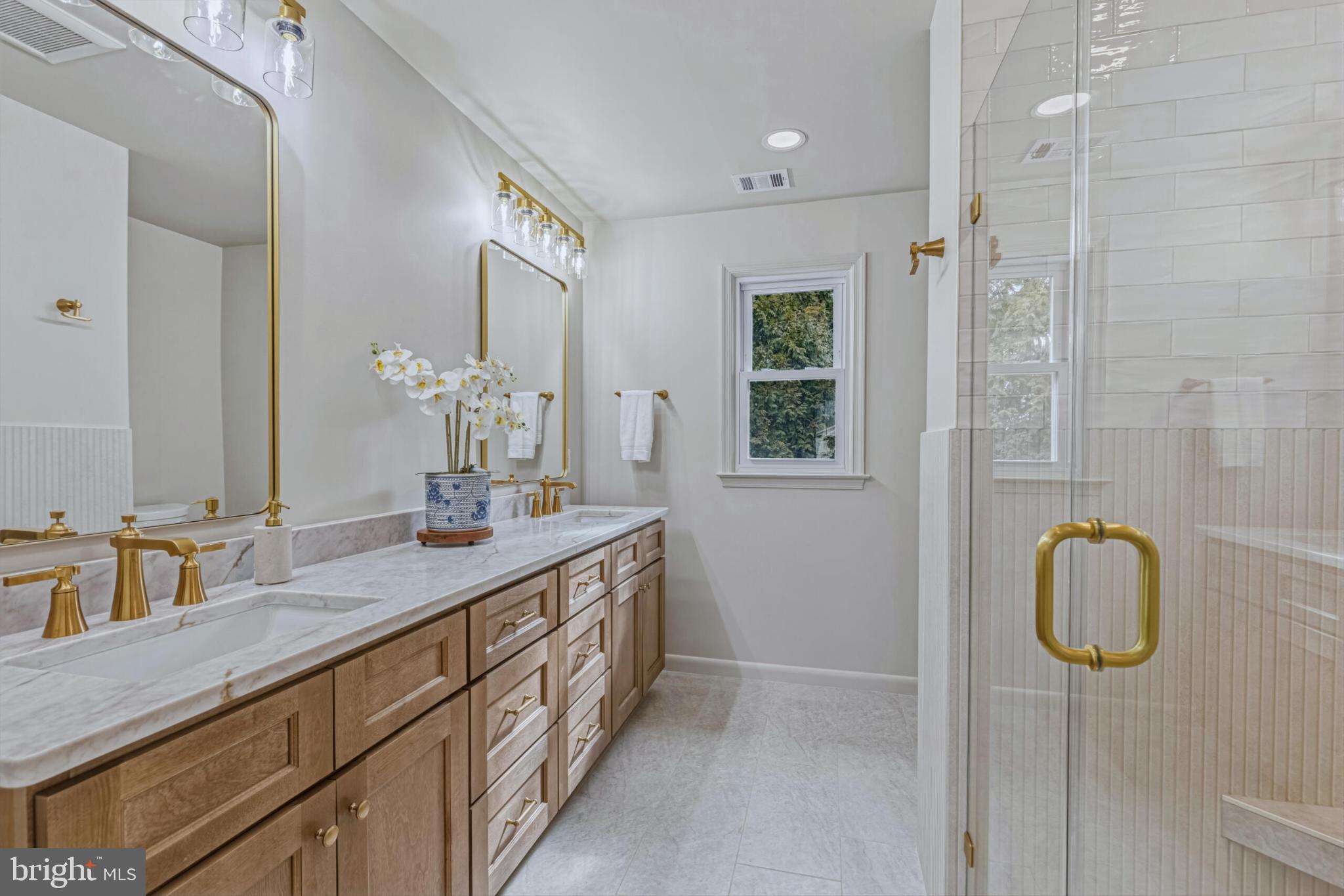 1331 Deep Run Lane Reston, VA 20190 - Photo 26 of 51 a bathroom with a double vanity sink and a mirror