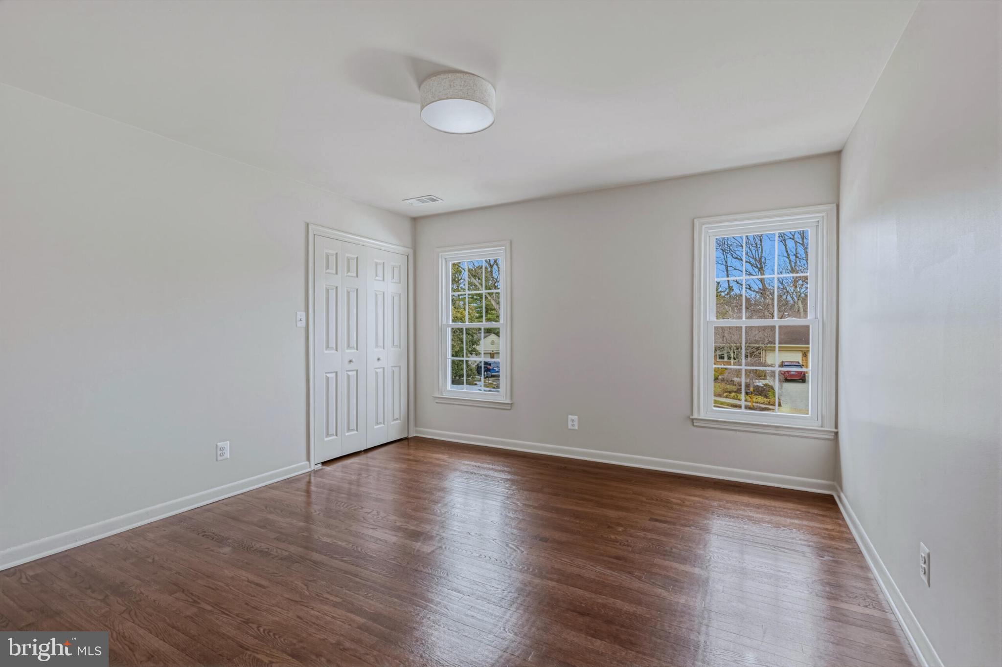 1331 Deep Run Lane Reston, VA 20190 - Photo 31 of 51 a view of an empty room with wooden floor and window