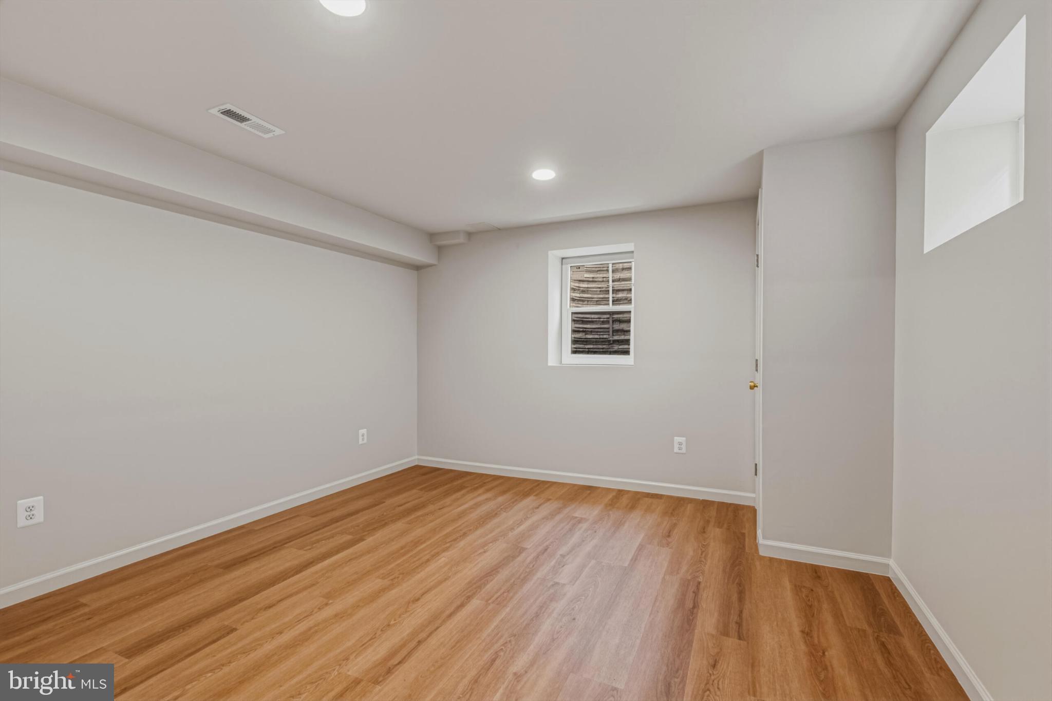 1331 Deep Run Lane Reston, VA 20190 - Photo 40 of 51 a view of a room with wooden floor and white walls