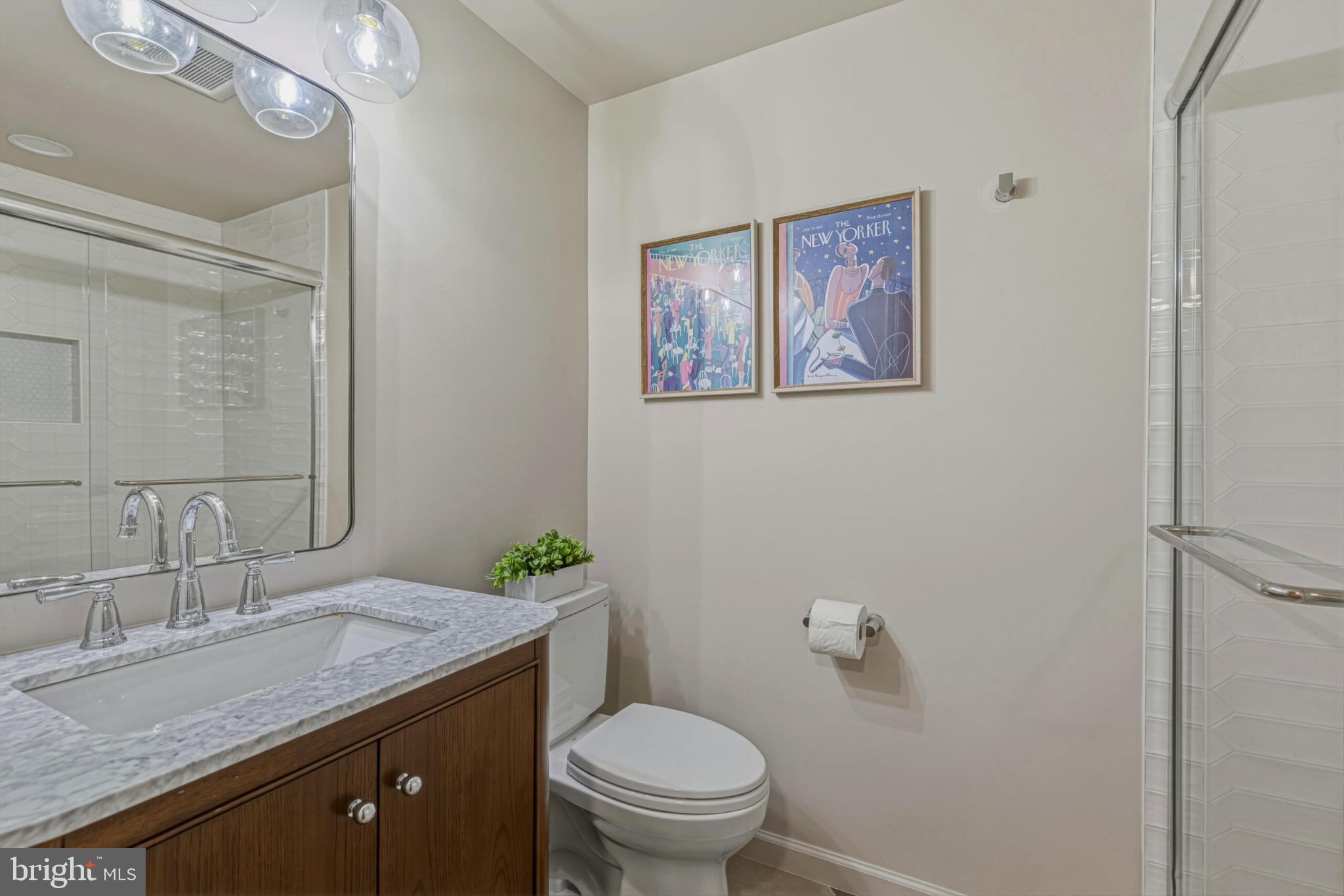1331 Deep Run Lane Reston, VA 20190 - Photo 41 of 51 a bathroom with a granite countertop toilet a sink and a mirror