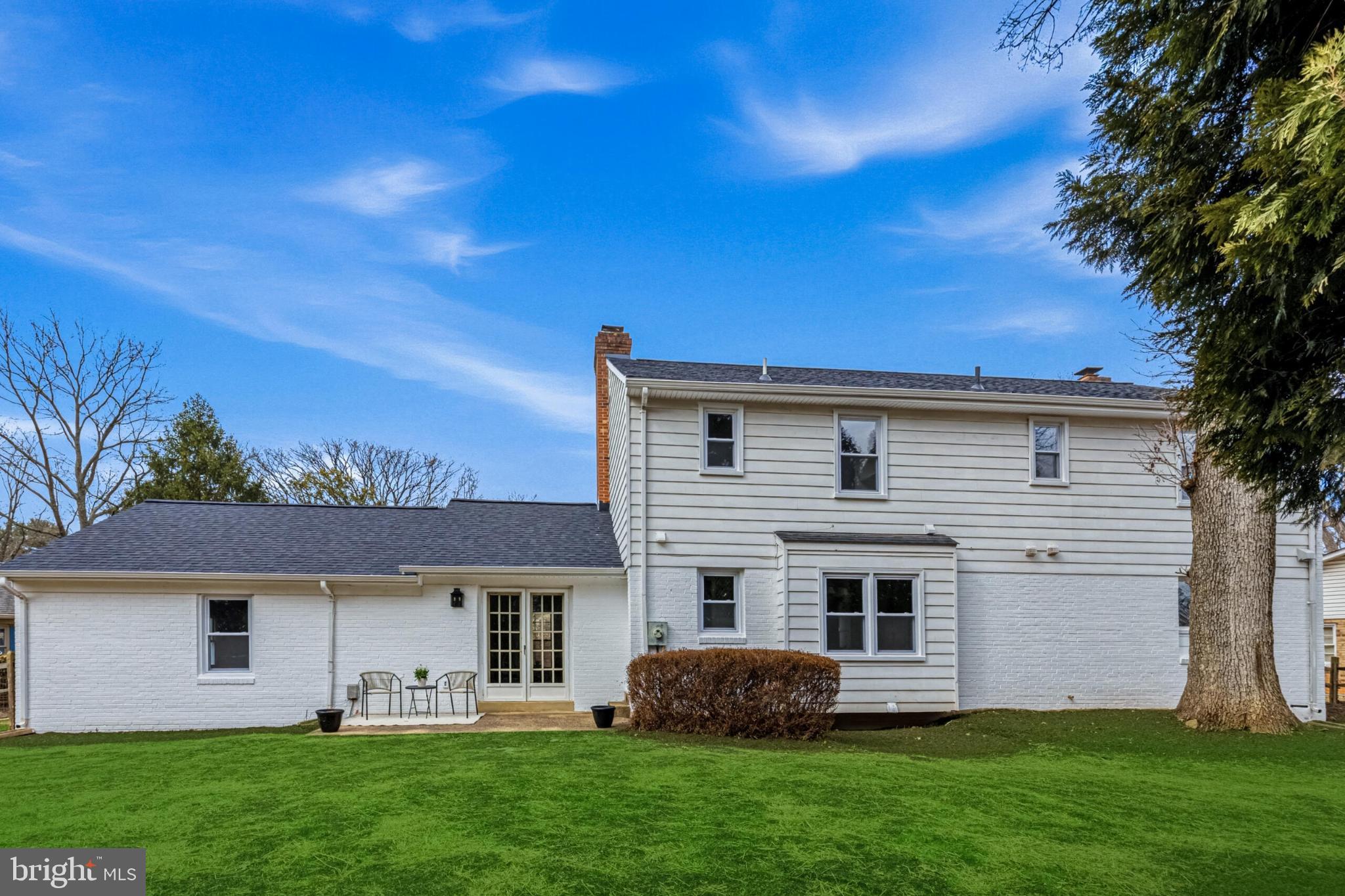 1331 Deep Run Lane Reston, VA 20190 - Photo 43 of 51 a front view of a house with a garden and yard