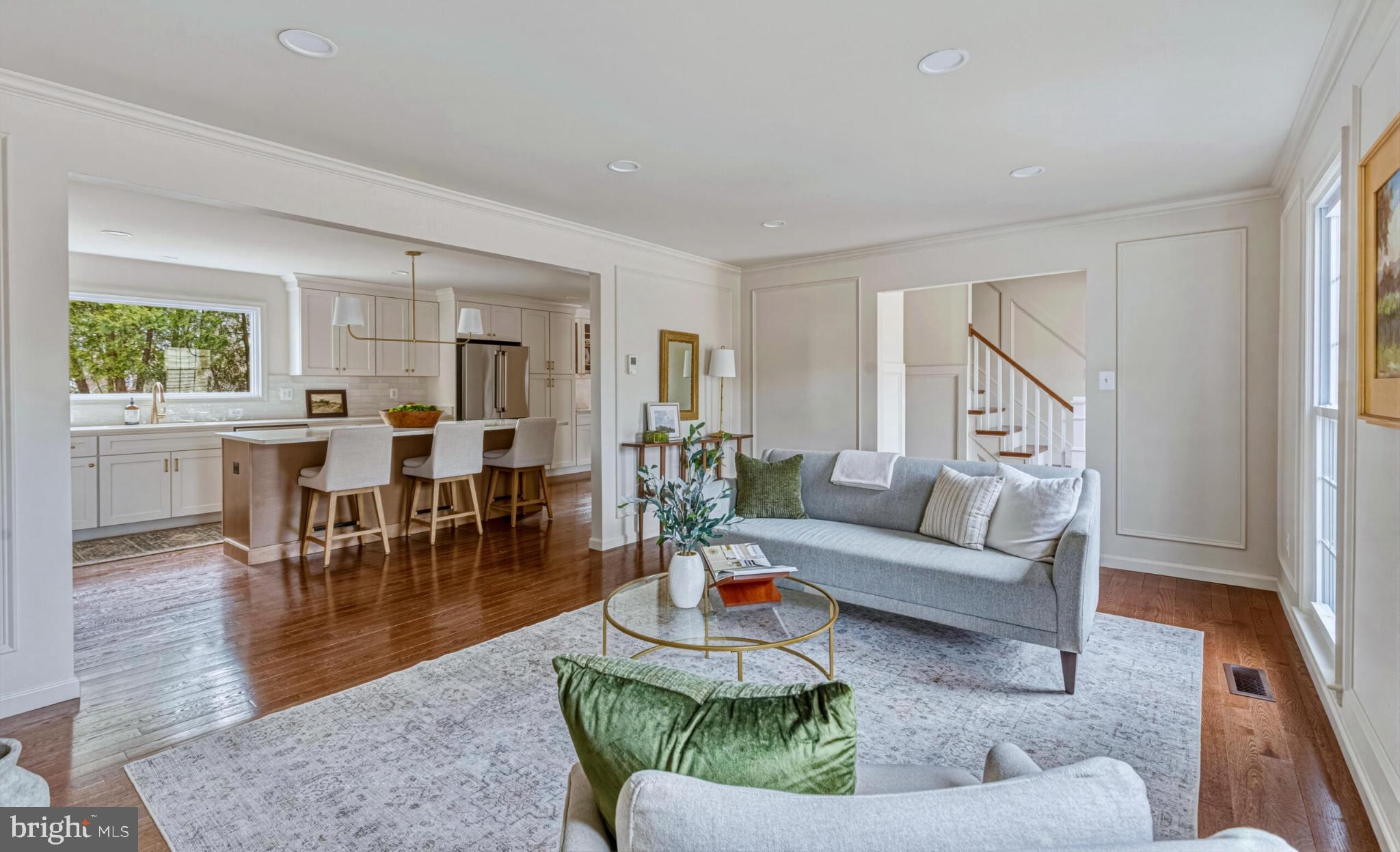 1331 Deep Run Lane Reston, VA 20190 - Photo 7 of 51 a living room with furniture and a dining table with kitchen view