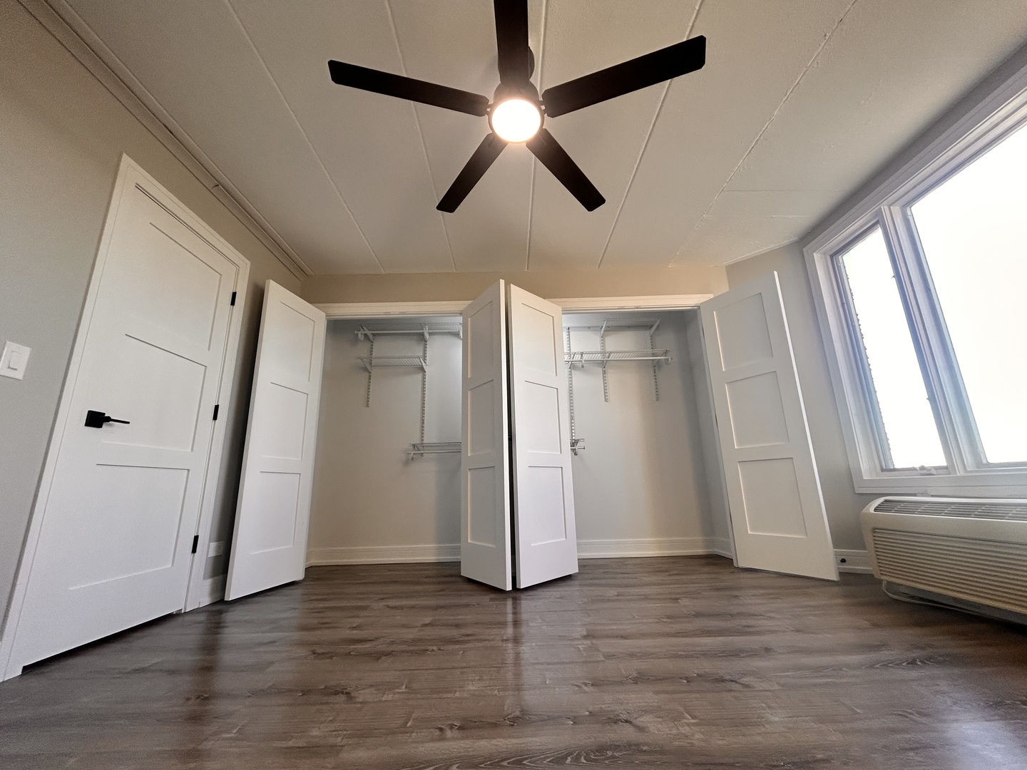 1 Renaissance Place, Unit 1216 Palatine, IL 60067 - Photo 11 of 17 a view of empty room with wooden floor and fan
