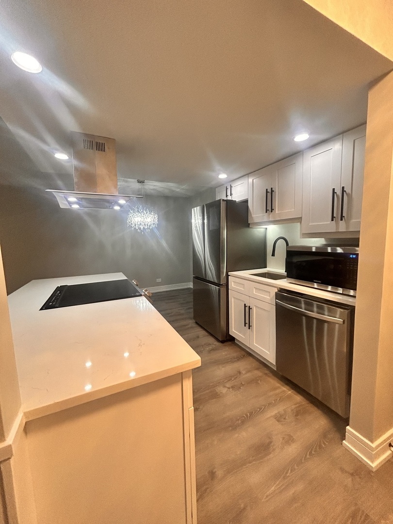 1 Renaissance Place, Unit 1216 Palatine, IL 60067 - Photo 5 of 17 a kitchen with stainless steel appliances a refrigerator and a stove