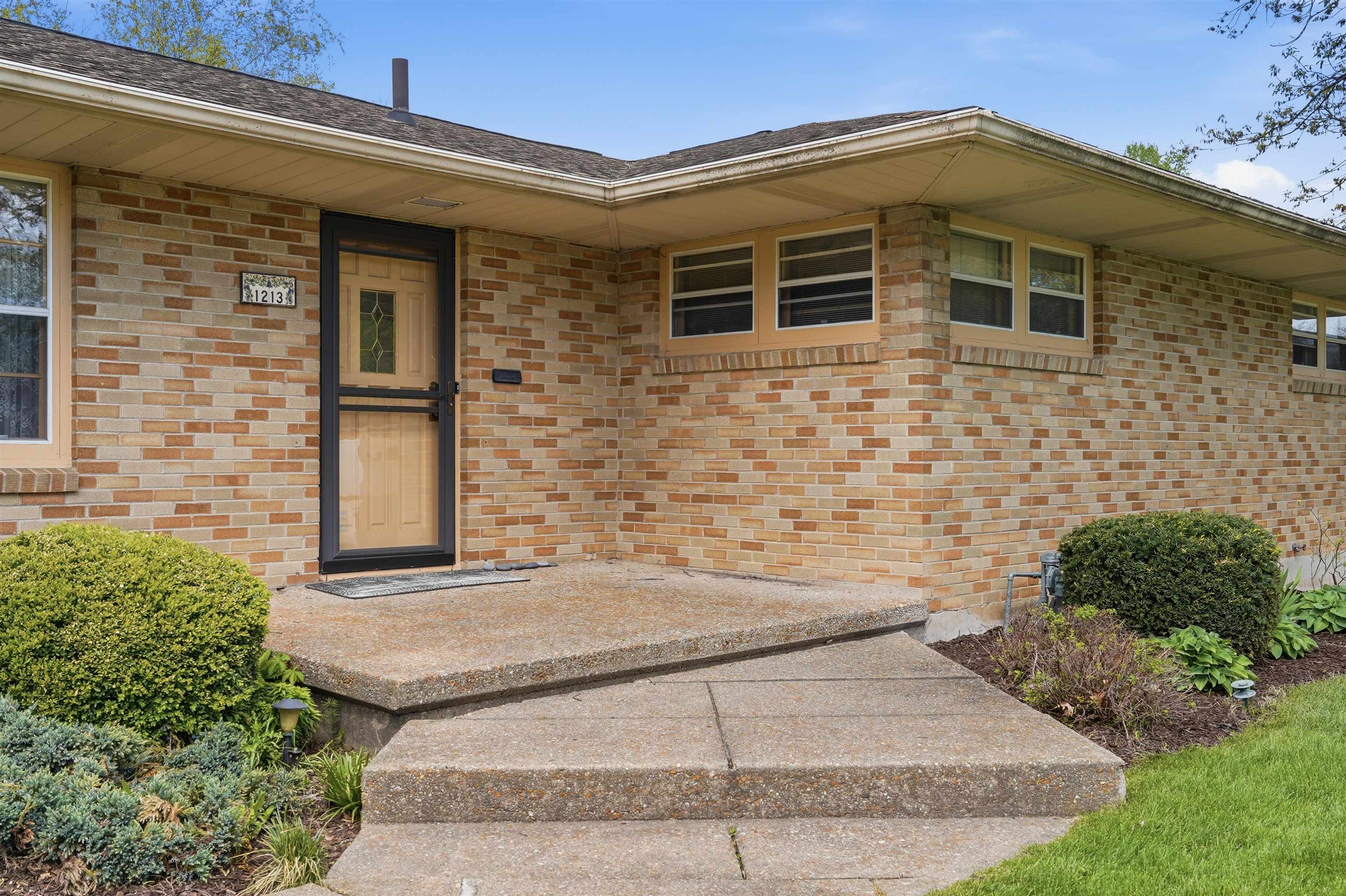 1213 Douglas Terrace Dixon, IL 61021 - Photo 11 of 49 a front view of a house with a yard