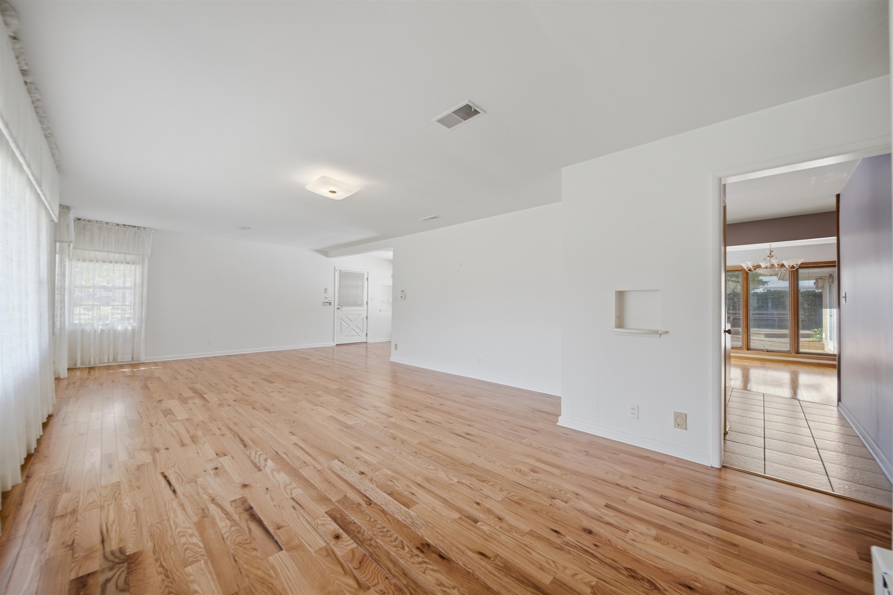 1213 Douglas Terrace Dixon, IL 61021 - Photo 12 of 49 a view of empty room with wooden floor and fan
