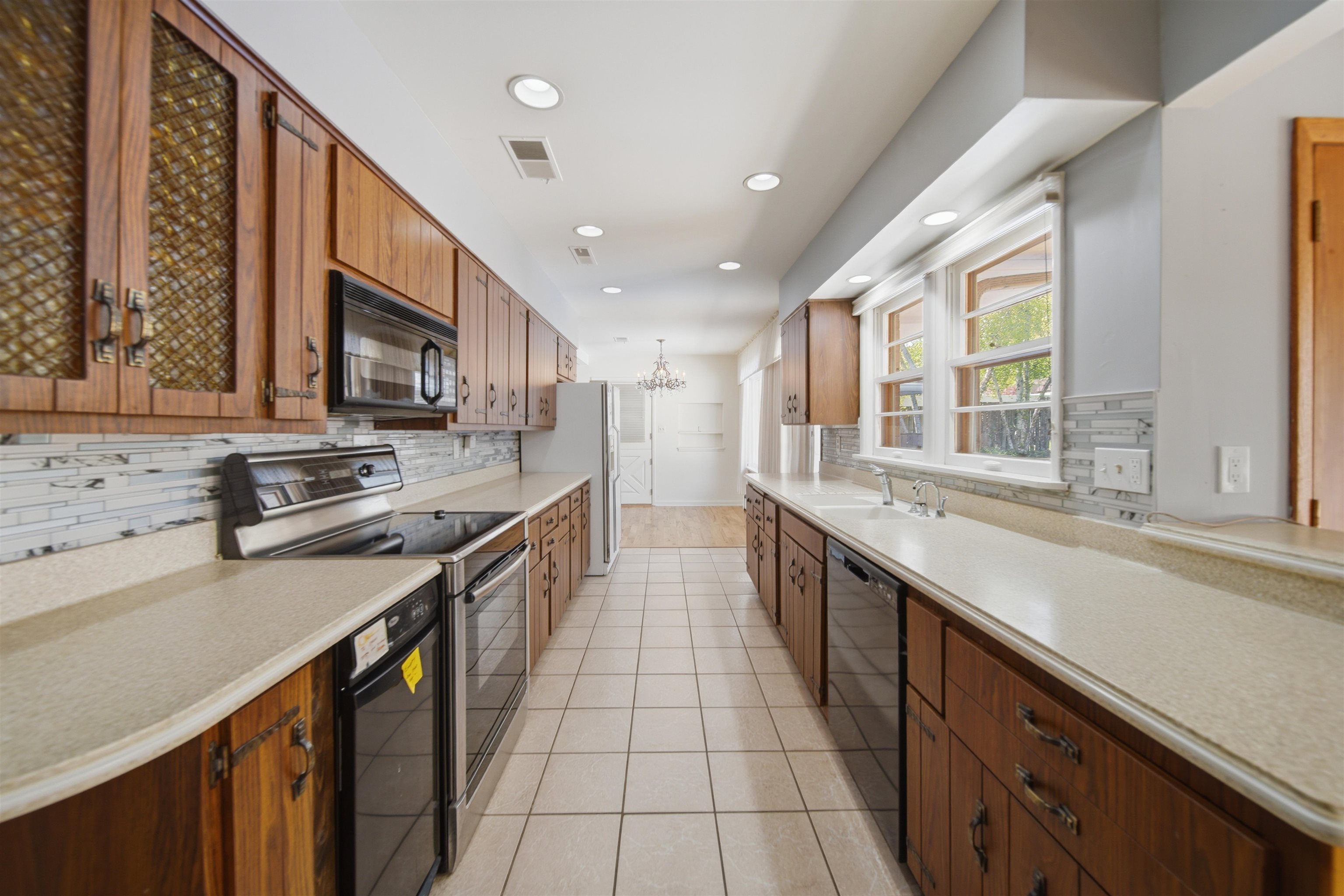 1213 Douglas Terrace Dixon, IL 61021 - Photo 14 of 49 a large kitchen with stainless steel appliances granite countertop a stove and a sink