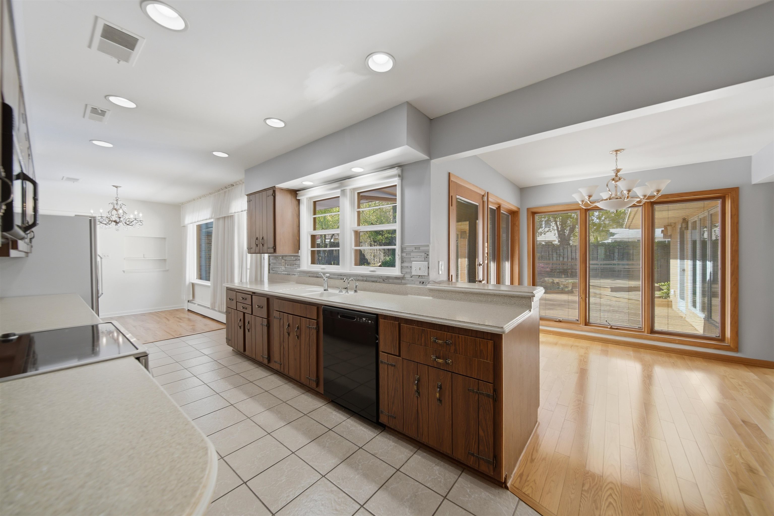 1213 Douglas Terrace Dixon, IL 61021 - Photo 16 of 49 a large kitchen with kitchen island granite countertop a large counter top space and stainless steel appliances