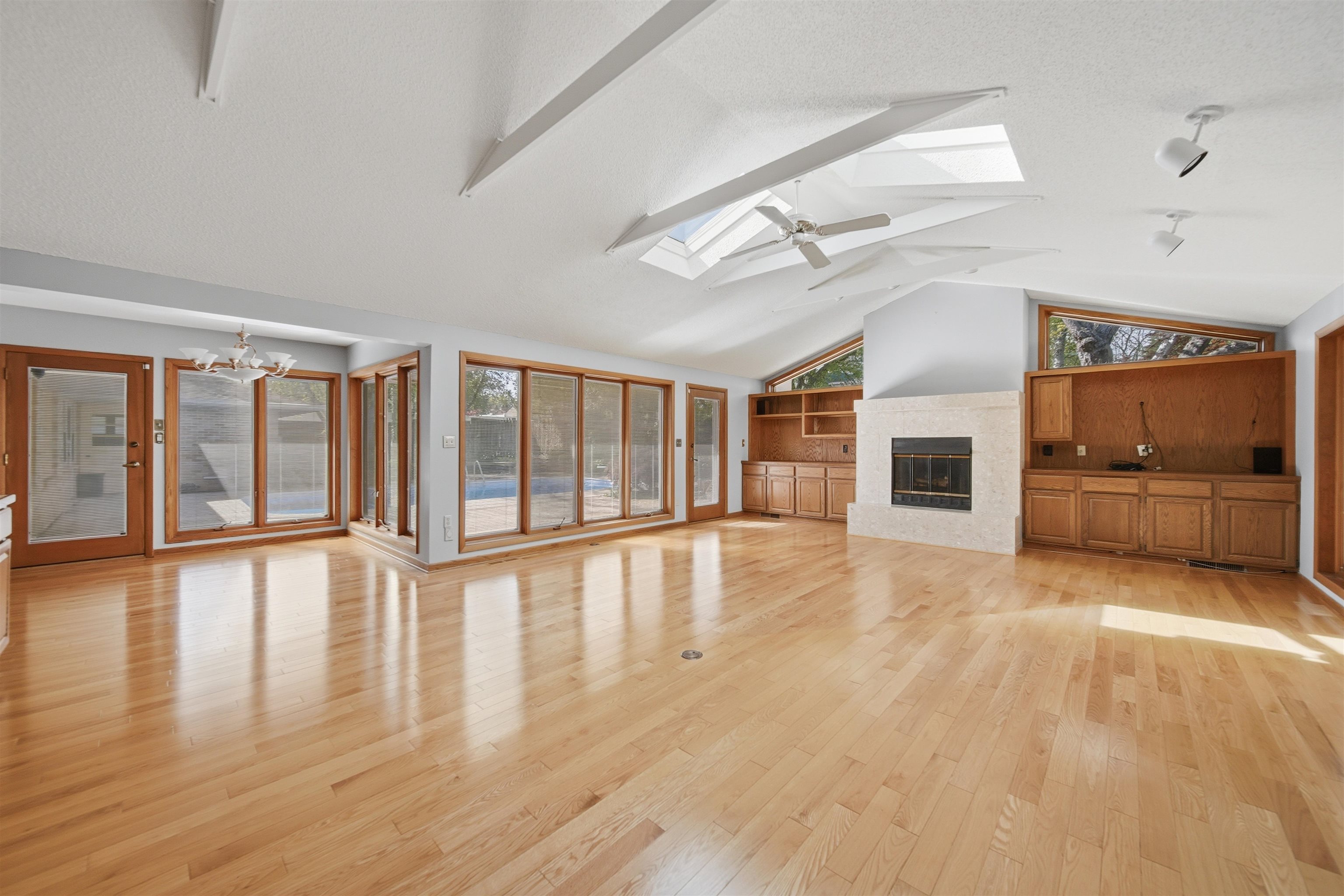 1213 Douglas Terrace Dixon, IL 61021 - Photo 17 of 49 a view of an empty room with wooden floor and a fireplace