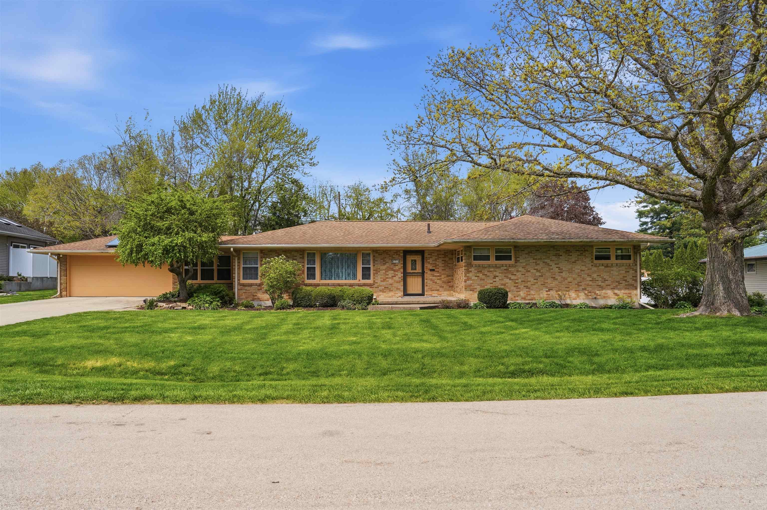 1213 Douglas Terrace Dixon, IL 61021 - Photo 2 of 49 a view of a yard in front of a house with a garden
