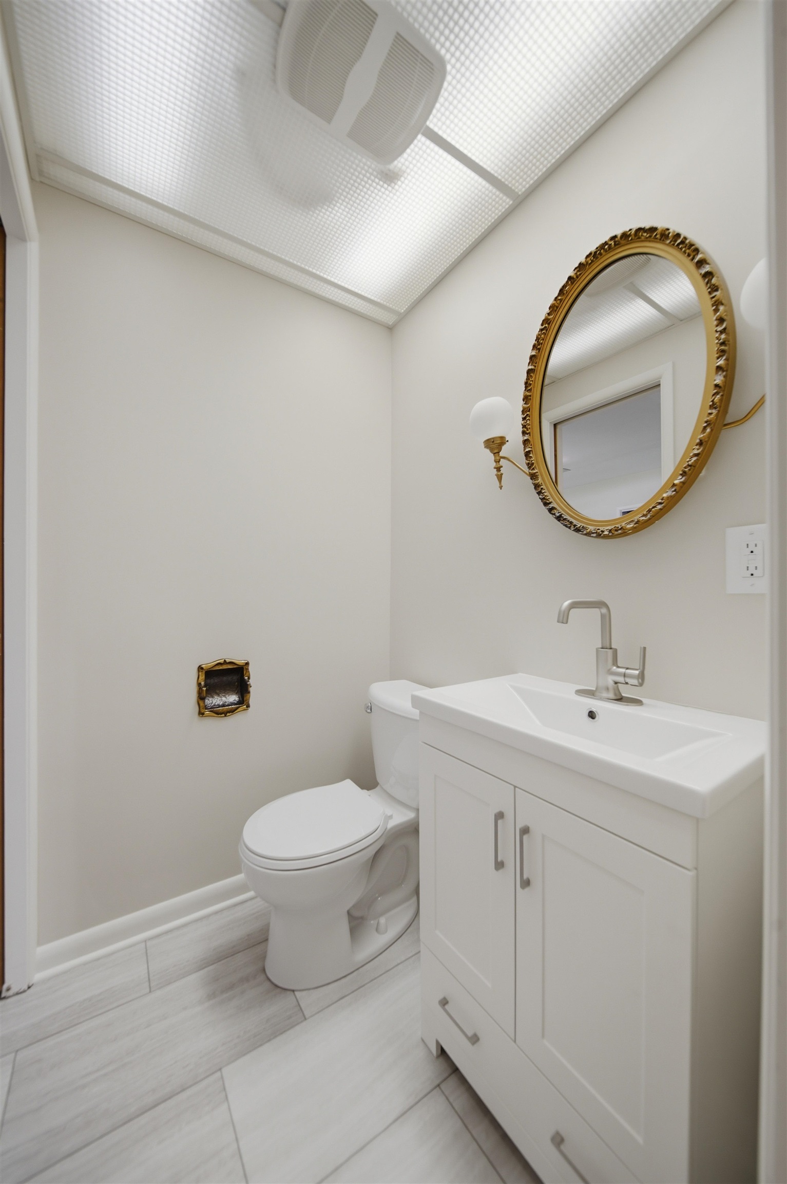 1213 Douglas Terrace Dixon, IL 61021 - Photo 25 of 49 a bathroom with a toilet sink and mirror