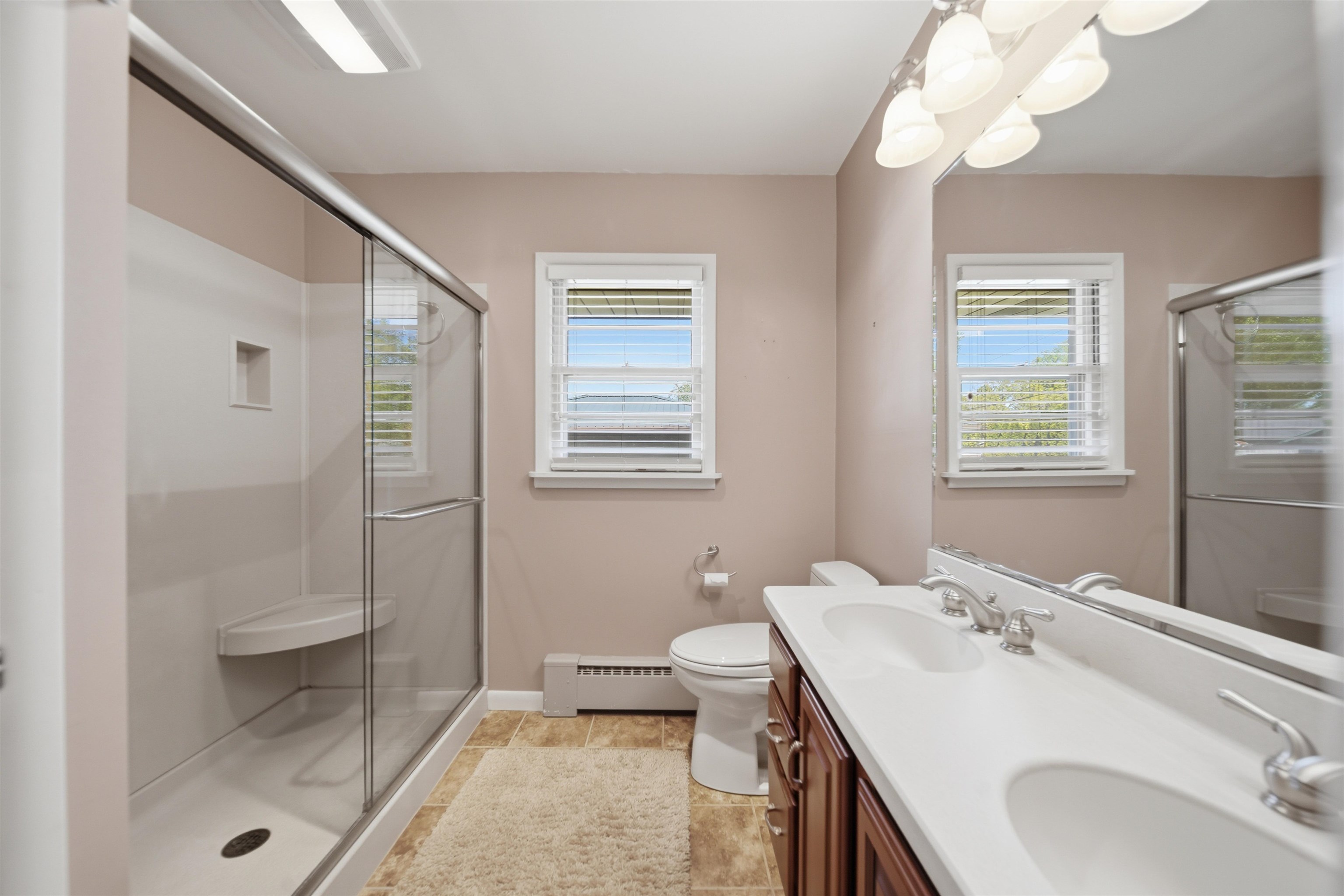 1213 Douglas Terrace Dixon, IL 61021 - Photo 27 of 49 a bathroom with a sink a toilet and a mirror