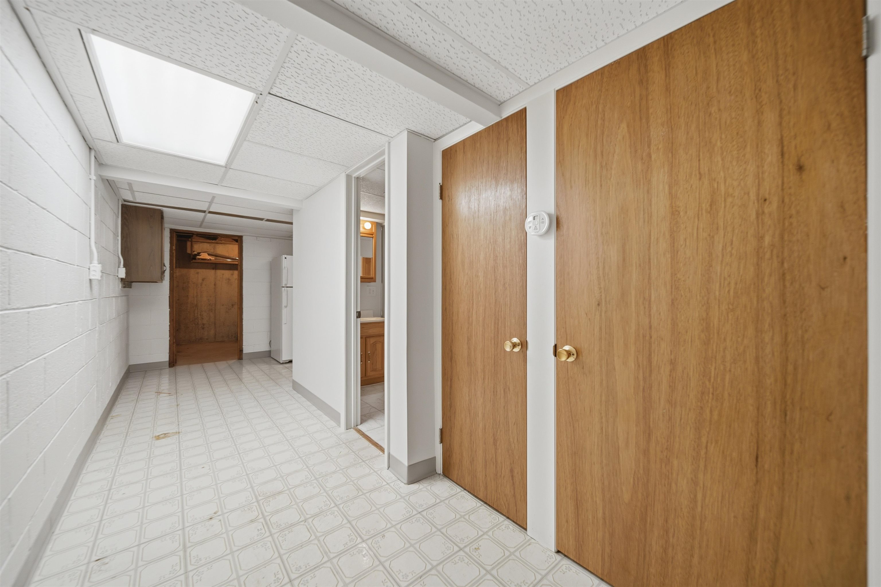 1213 Douglas Terrace Dixon, IL 61021 - Photo 36 of 49 a view of a hallway with wooden shelves