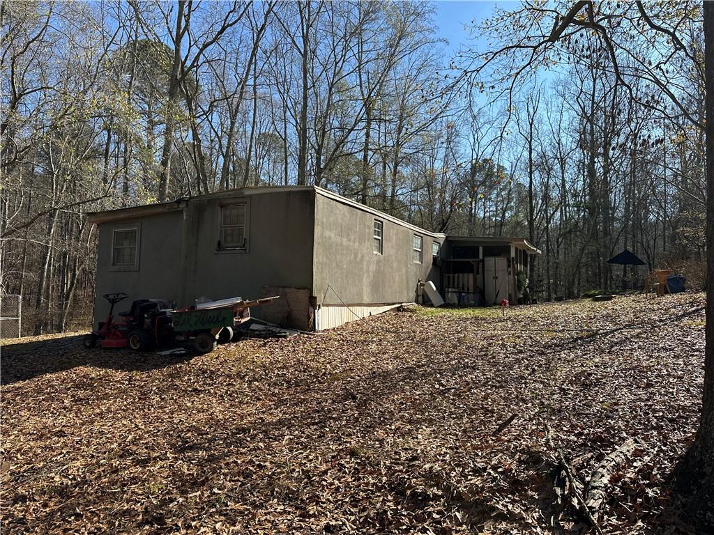 198 Sweetwater Trail Villa Rica, GA 30180 - Photo 17 of 35 a backyard of a house with a large tree