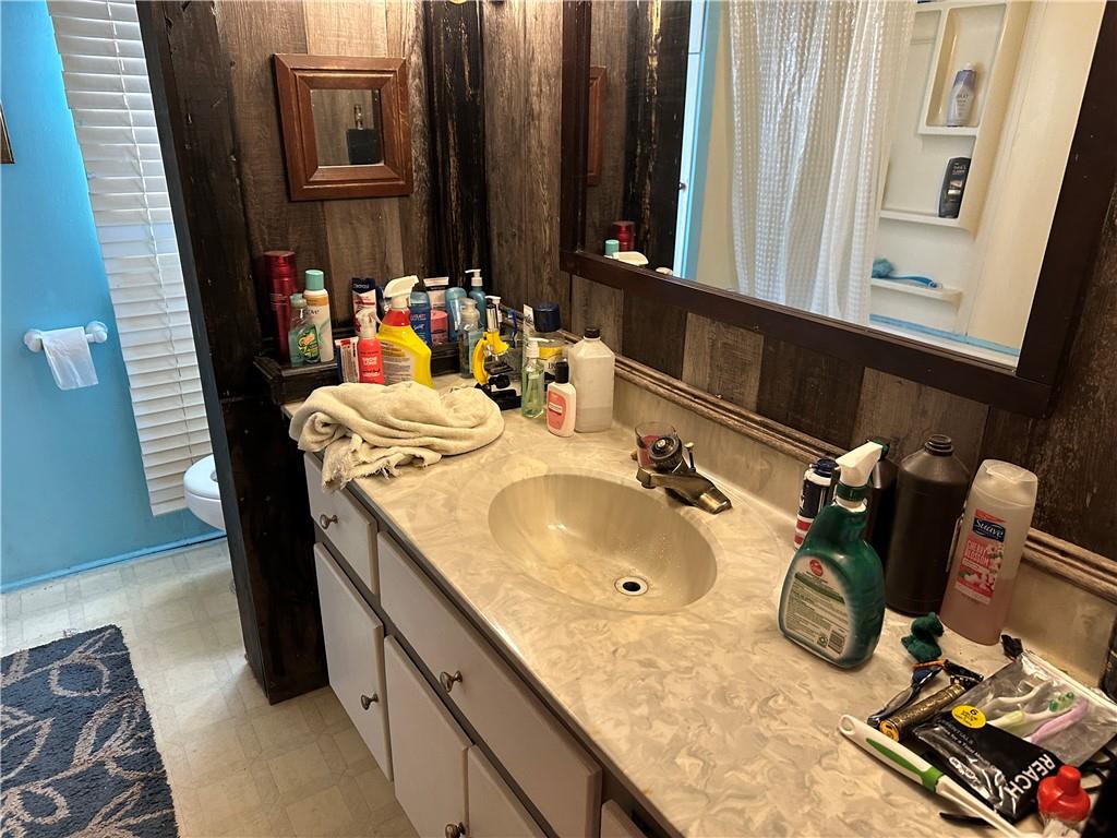198 Sweetwater Trail Villa Rica, GA 30180 - Photo 20 of 35 a bathroom with a sink and a mirror