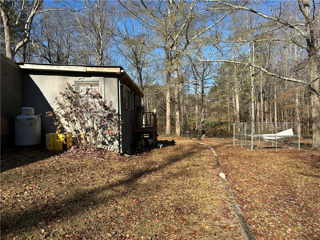 198 Sweetwater Trail Villa Rica, GA 30180 - Photo 24 of 35 a view of a yard with wooden fence