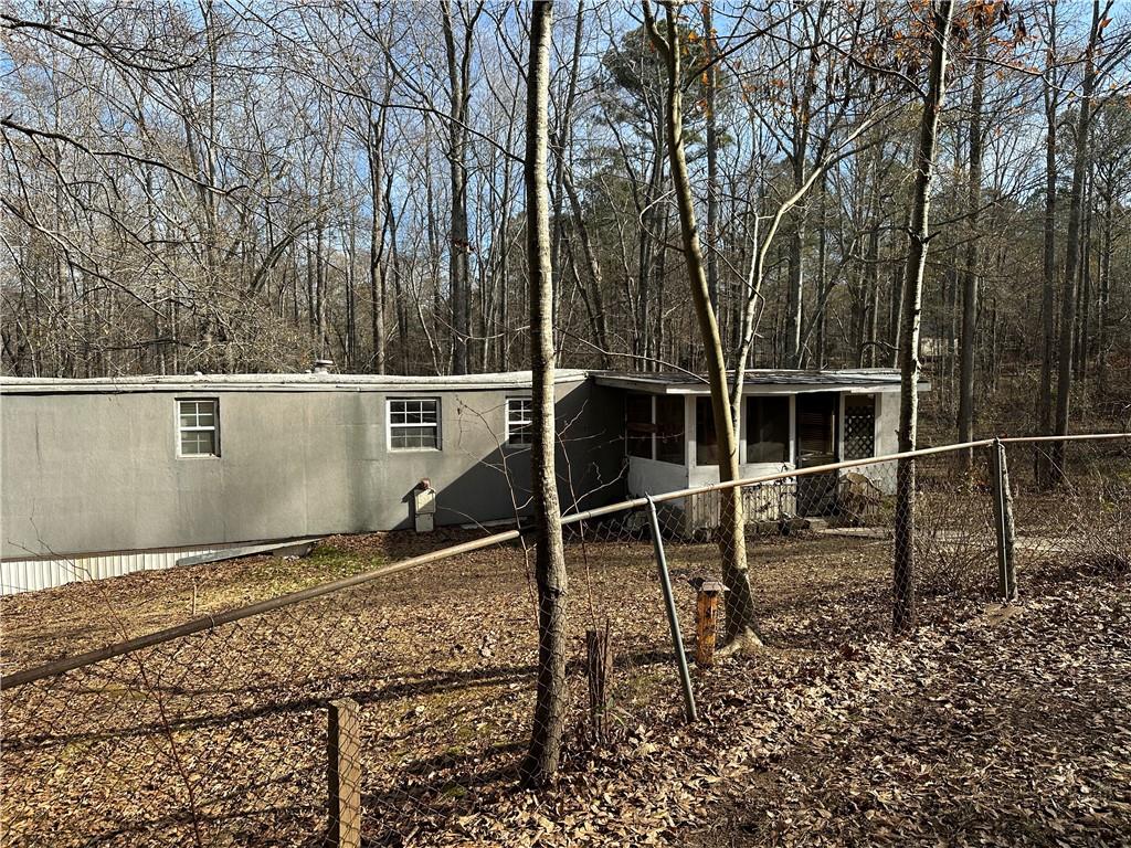 198 Sweetwater Trail Villa Rica, GA 30180 - Photo 35 of 35 a backyard of a house with barbeque oven