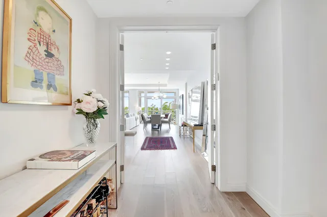 a view of a dining room with furniture wooden floor and a chandelier