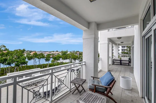 a view of a balcony with chairs