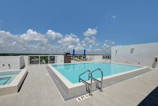 a view of a swimming pool with a lounge chair